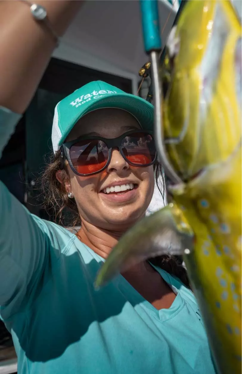 Smiling angler wearing Fin-Nor sunglasses