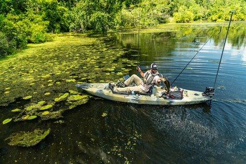 Angler in kayak holding fish